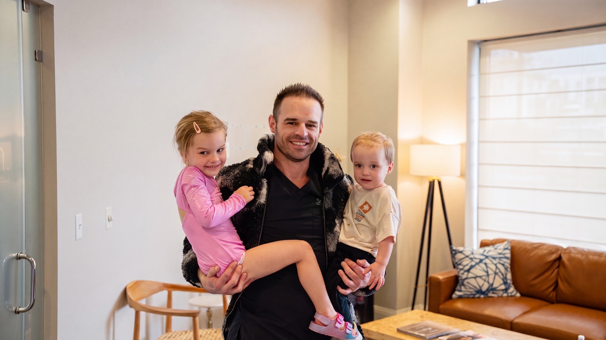 Dr. Trembley with his two children in the Smile On Nashville studio lounge