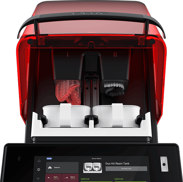 3D printer producing a red dental mold